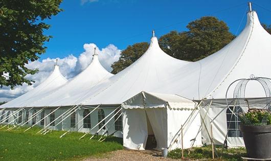 a line of sleek and modern porta potties ready for use at an upscale corporate event in Oxford